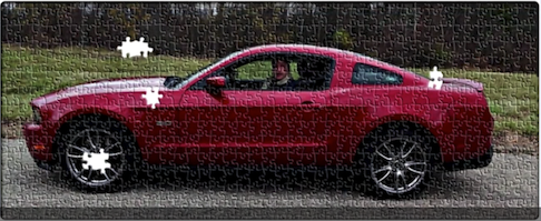 A puzzle of a red car Description automatically generated